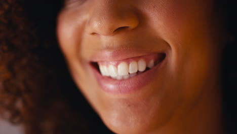 Studio-Close-Up-Shot-Of-Laughing-Woman's-Mouth-Promoting-Body-Positivity