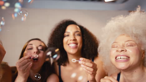 Group-Of-Body-Positive-Women-Friends-In-Underwear-Blowing-Bubbles-In-Studio