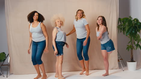 Group-Of-Diverse-Body-Positive-Casually-Dressed-Women-Friends-One-With-Prosthetic-Limb-Jumping