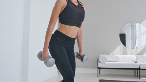young-fit-and-energetic-woman-doing-sport-workout-and-fitness-lunge-exercises-with-weights-for-healthy-lifestyle-in-living-room-at-home-during-sunny-day