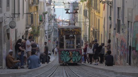 Old-graffiti-painted-tramway-in-Lisbon-street-Portugal