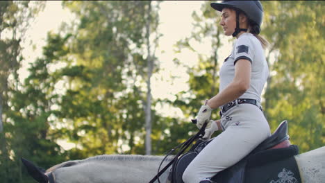 Female-is-riding-on-her-horse.-Training-of-equitation-skills.