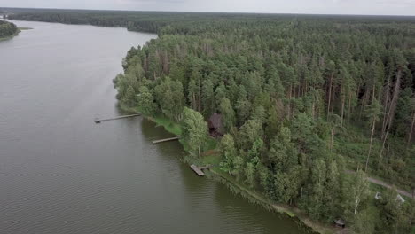 Aerial-view-of-leisure-base-in-the-wood-on-river-bank