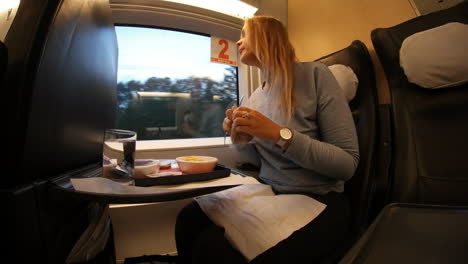 Woman-getting-hungry-during-train-trip