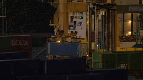 Loading-container-cargo-ship-in-industrial-port-at-night-Barcelona-Spain