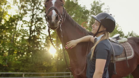 It's-a-sunny-day-with-lovely-horse.-Horsewomen-is-stroking-her-brown-horse.-These-are-amazing-and-tender-feelings.
