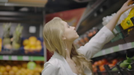 Woman-Buying-Yellow-Pepper-in-Supermarket.-Female-take-and-Choosing-Organic-Vegetables-in-Grocery-Store.-Zero-Waste-Shopping-and-Healthy-Lifestyle-Concept.-Slow-motion.