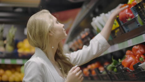Woman-Buying-red-Pepper-in-Supermarket.-Female-Hand-Choosing-Organic-Vegetables-in-Grocery-Store.-Zero-Waste-Shopping-and-Healthy-Lifestyle-Concept.-Slow-motion