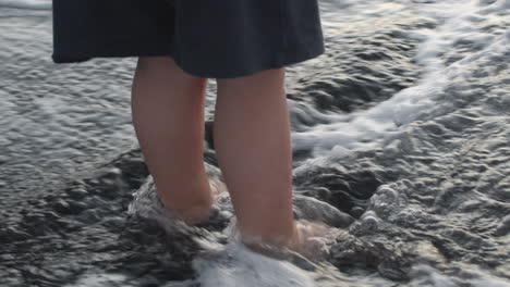 A-slowmotion-of-waves-washing-childs-feet