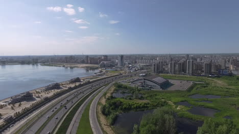 Aerial-waterside-view-of-Kazan-Russia-City-buildings-and-highway