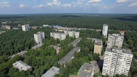 An-aerial-view-of-multi-storey-residential-buildings-drowning-in-green-tree-crowns