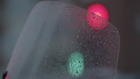 Traffic-lights-view-through-wet-glass
