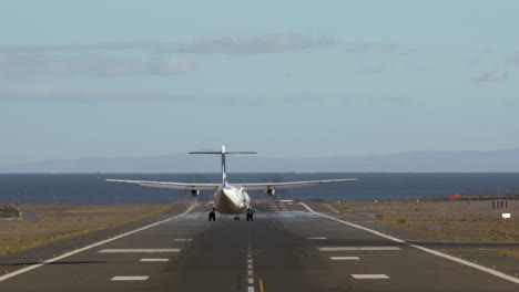 Jetliner-landing-on-runway-by-the-sea