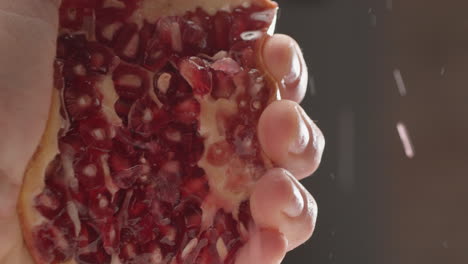 Squeezing-juicy-pomegranate