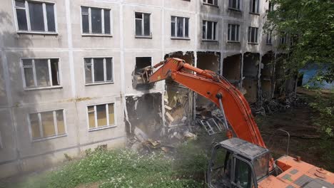 Taking-down-dilapidated-apartment-house-aerial-view