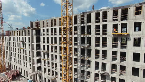 Aerial-view-of-unfinished-residential-complex-with-builders-working