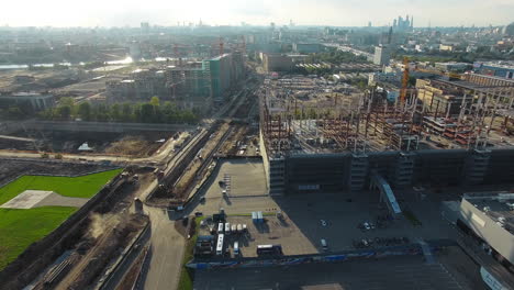 An-aerial-view-of-large-construction-sites-as-a-part-of-a-sunny-urbanscape