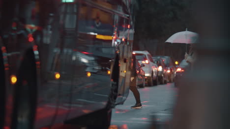 Pedestrians-crossing-the-street-view-on-rainy-evening