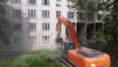 An-excavator-destroys-the-building-with-its-bucket