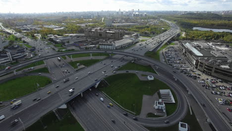 Aerial-timelapse-of-busy-metropolis-with-traffic-on-interchange