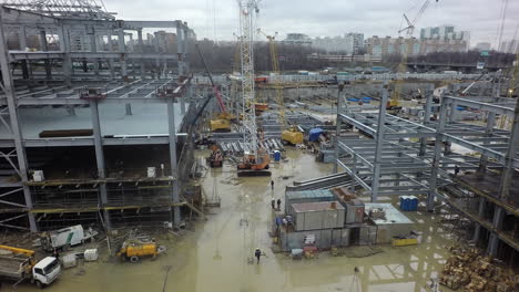 Aerial-view-of-construction-site-with-unfinished-steel-frame-buildings