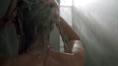 Woman-washing-hair-in-the-shower