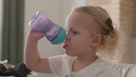 Little-child-drinking-milk-from-the-bottle