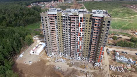 High-rise-apartment-block-in-city-outskirts-aerial-view