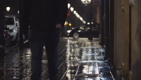 People-under-the-rain-in-night-city