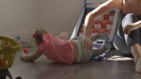 Rolling-on-the-floor-is-fun-for-this-little-girl