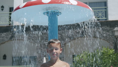 A-boy-taking-an-outdoor-shower
