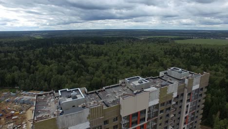 Aerial-view-of-new-apartment-block-with-unfinished-facade