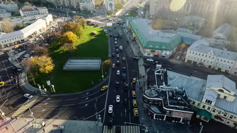 An-aerial-view-of-a-small-traffic-roundabout-in-the-middle-of-sunny-urbanscape