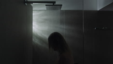 Woman-under-the-shower-Calming-down-with-water