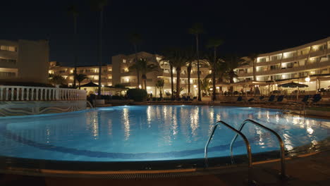 Resort-scene-with-a-pool-at-night