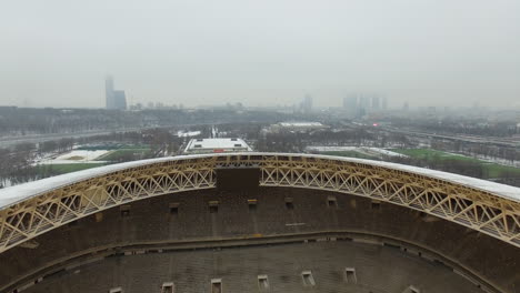 Copter-flying-up-from-inside-Luzhniki-Stadium-in-Moscow-winter-view