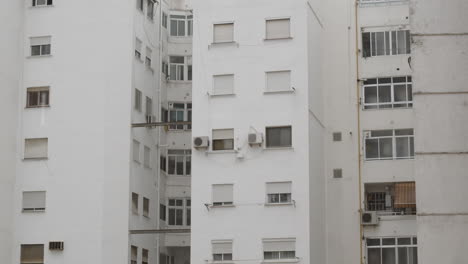 Block-of-flats-with-shuttered-windows-view-in-the-rain