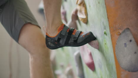 Close-Up-Of-Feet-Shod-In-Shoes-For-Rock-Climbing-Overcome-Obstacles-On-The-Climbing-Wall.
