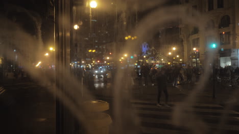 Looking-at-night-city-through-the-glass