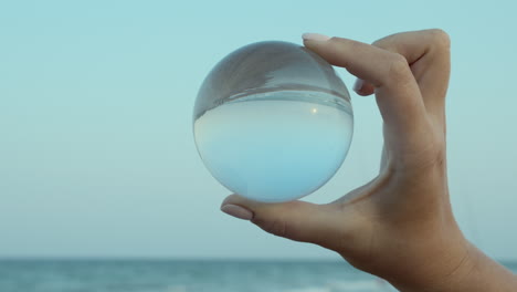 Transparent-glass-ball-in-hand