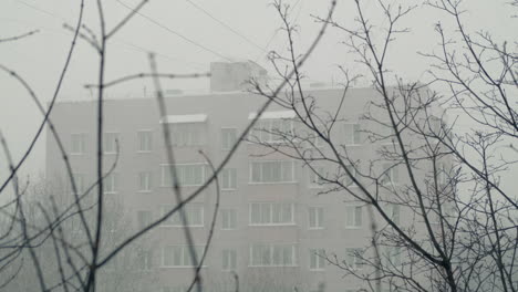 Block-of-flats-and-heavy-snow-falling