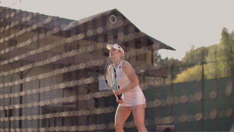 A-professional-woman-in-a-white-tight-suit-hits-the-ball-with-a-racket-and-dynamically-plays-on-the-tennis-court.