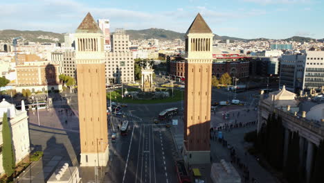 Flying-to-Spain-Square-through-Venetian-Towers-in-morning-Barcelona-Spain