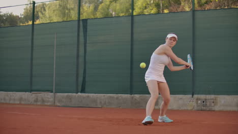 Beautiful-woman-tennis-player-plays-balls-on-the-tennis-court.-Professional-tennis-player-slow-motion.
