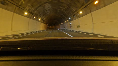 Car-journey-along-scenic-road-and-driving-through-the-mountain-tunnel