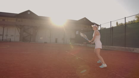Tennis-Player-Reaching-To-Hit-Ball.-Female-tennis-player-reaching-to-hit-the-tennis-ball-on-court