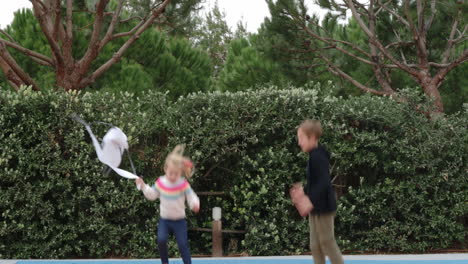 Kids-enjoying-trampoline-jumping-on-the-outdoor-playground