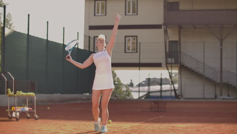 Tennis-player-prepares-to-serve-ball-during-tennis-match