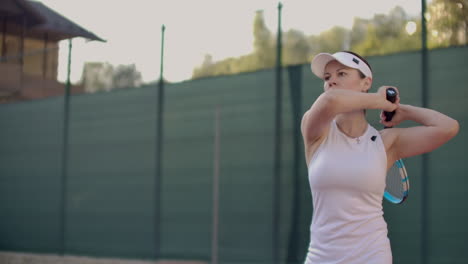 Beautiful-woman-tennis-player-plays-balls-on-the-tennis-court.-Professional-tennis-player-slow-motion.