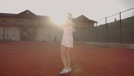 Tennis-Player-Reaching-To-Hit-Ball.-Female-tennis-player-reaching-to-hit-the-tennis-ball-on-court